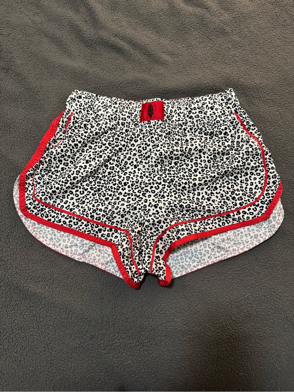 FP Movement by Free People White & Black Leopard Athletic Shorts with Red Trim
